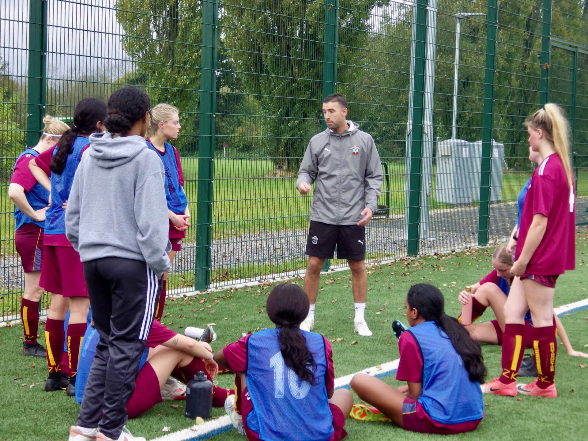 Dave coaching players on the pitch